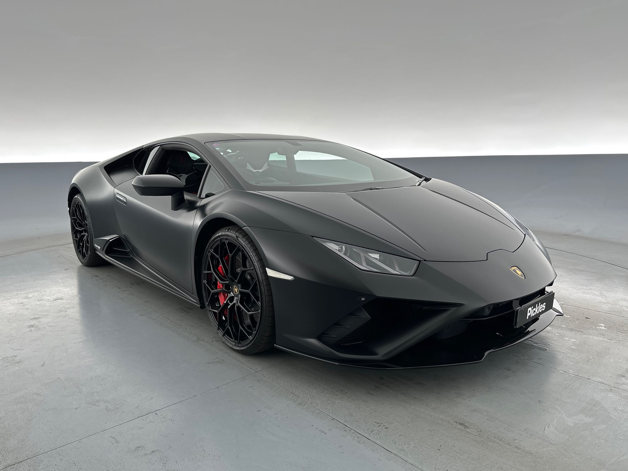 View a black 2021 Lamborghini Huracan STO available via auction.