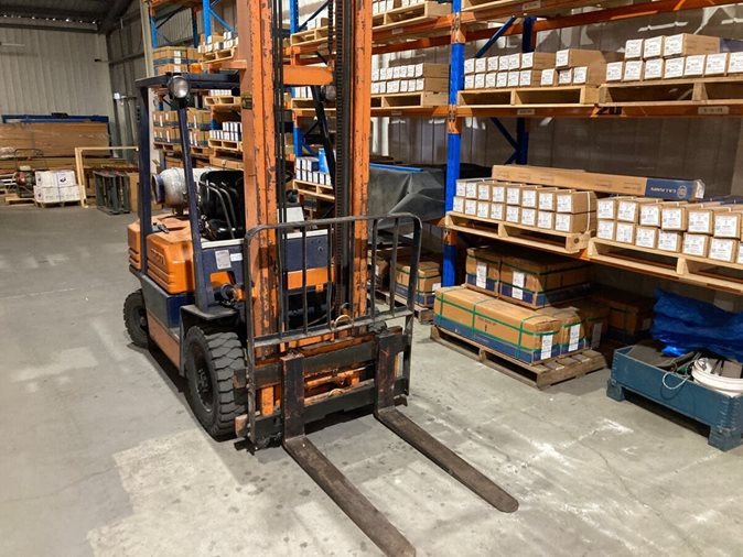 Orange forklift at a warehouse