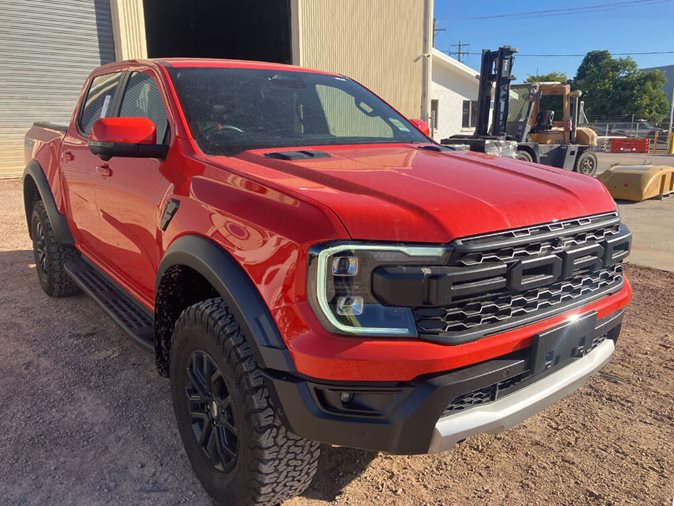 View a red 2024 Ford Ranger Raptor available via auction.