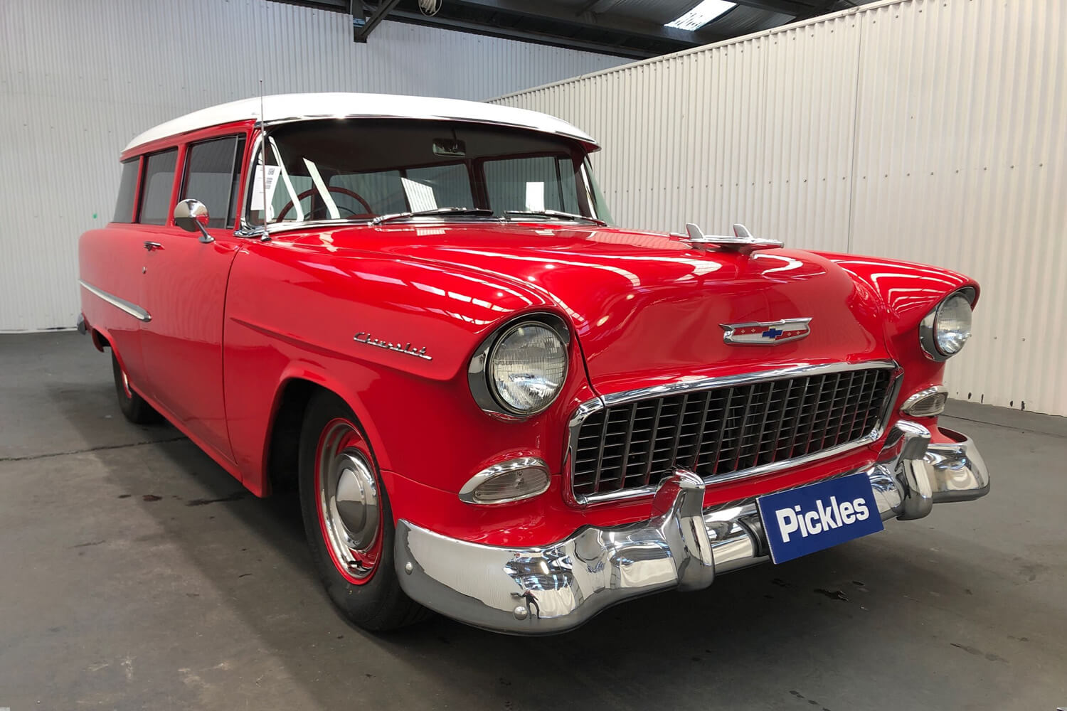 View a red 1955 Chevrolet 210 available via auction.