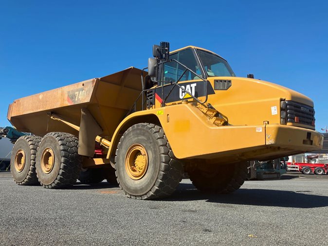 Yellow 2006 Caterpillar 740 6x6 Articulated Dump Truck via auction.