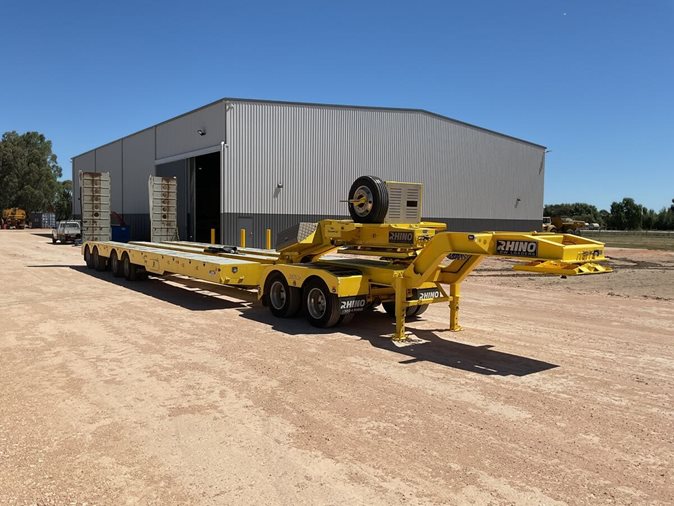 View yellow 2021 Rhino quad axle deck spread low loader available via auction.