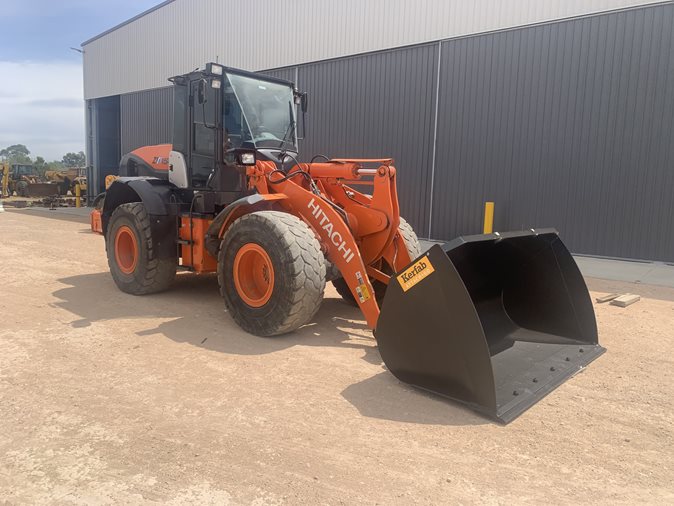 View orange 2019 Hitachi ZW150 articulated front end loader available via auction.